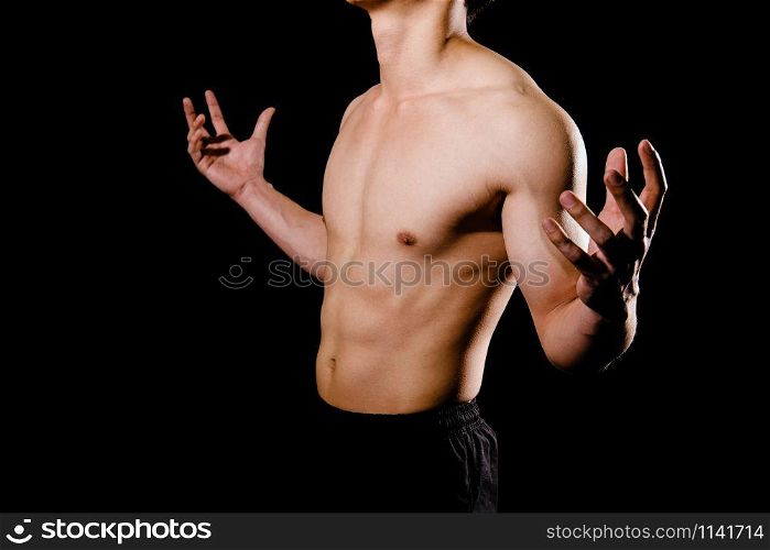portrait of athletic muscular bodybuilder man with naked torso six pack abs. fitness workout concept