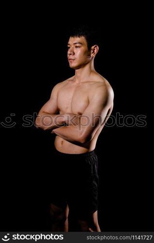 portrait of athletic muscular bodybuilder man with naked torso six pack abs. fitness workout concept