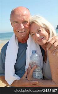 Portrait of athletic senior couple on the beach