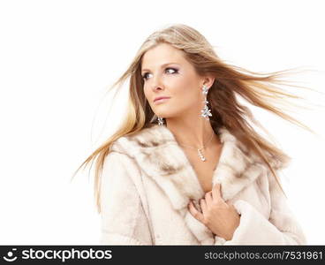 Portrait of attractive blonde in a fur coat, isolated