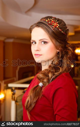 Portrait of attractive brown-haired woman indoors