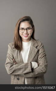 Portrait of Attractive business woman in studio grey background