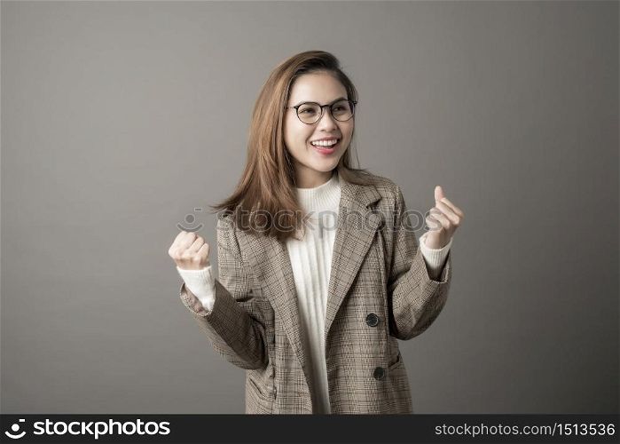 Portrait of Attractive business woman in studio grey background