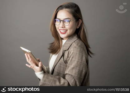 Portrait of Attractive business woman in studio grey background