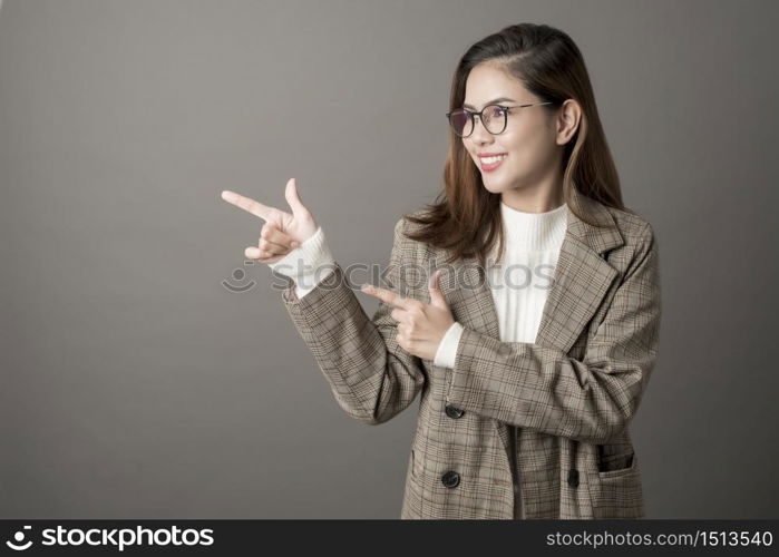 Portrait of Attractive business woman in studio grey background