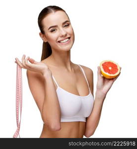 portrait of attractive caucasian smiling woman holding grapefruit isolated on white. portrait of attractivesmiling woman holding grapefruit isolated on white