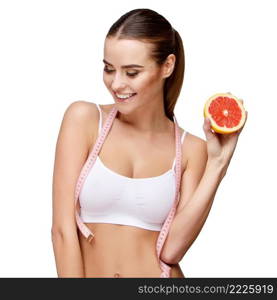 portrait of attractive caucasian smiling woman holding grapefruit isolated on white. portrait of attractivesmiling woman holding grapefruit isolated on white