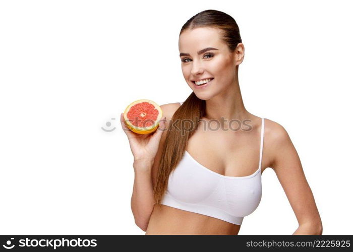 portrait of attractive caucasian smiling woman holding grapefruit isolated on white. portrait of attractivesmiling woman holding grapefruit isolated on white