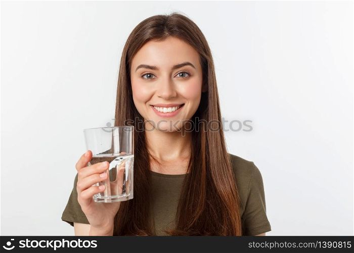 portrait of attractive caucasian smiling woman isolated on white studio shot drinking water. portrait of attractive caucasian smiling woman isolated on white studio shot drinking water.