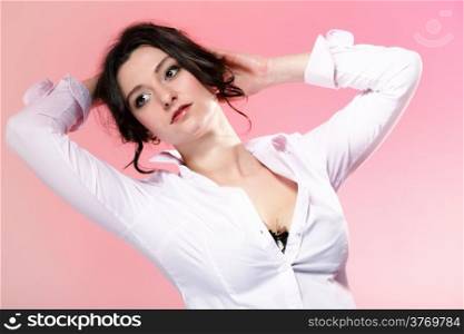 portrait of attractive caucasian woman brunette pink background studio shot