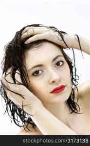 Portrait of attractive Caucasian young woman redhead with wet hair.