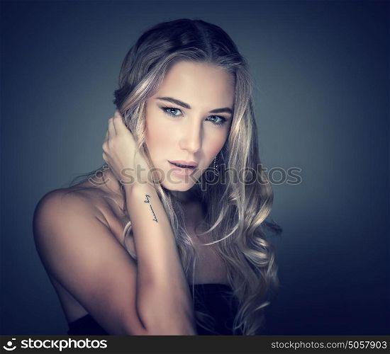 Portrait of attractive female with beautiful makeup and hairstyle isolated on dark background, luxury beauty salon, fashion concept