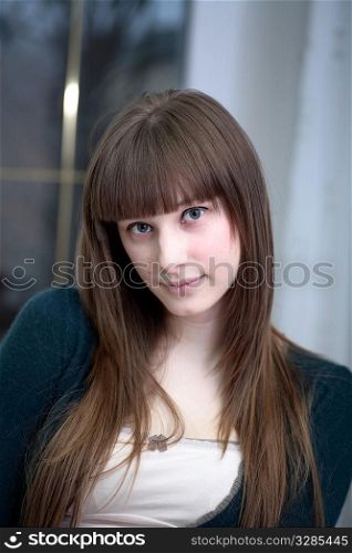 Portrait of attractive girl in a room