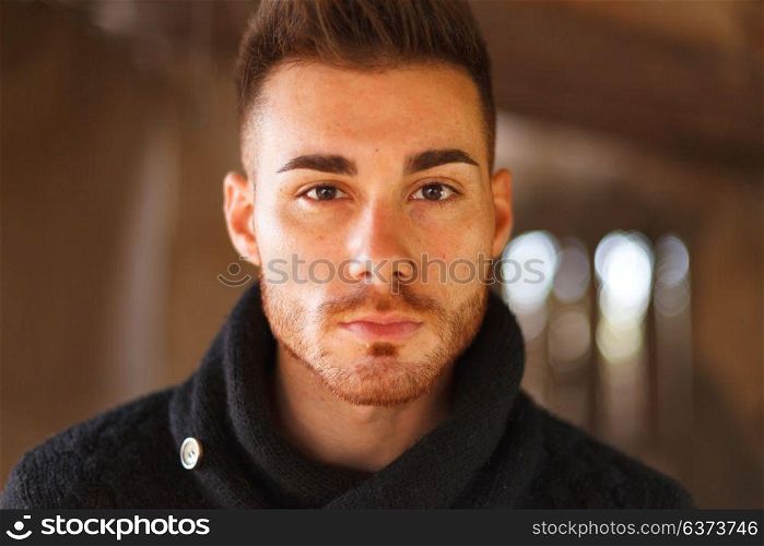 Portrait of attractive guy in a old house