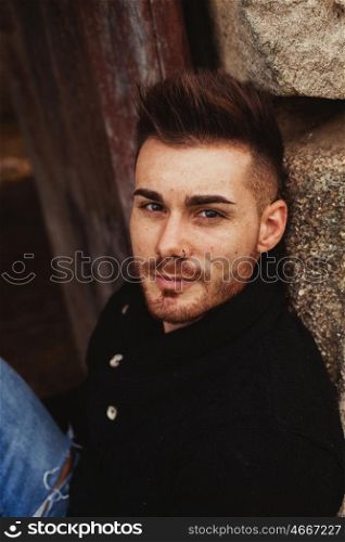 Portrait of attractive guy in a old house. Photos for ads
