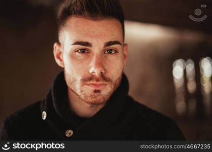 Portrait of attractive guy in a old house. Photos for ads