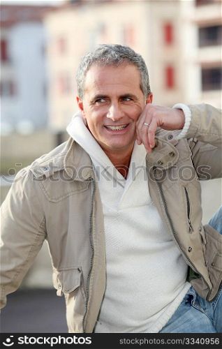 Portrait of attractive mature man in town