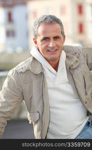 Portrait of attractive mature man in town