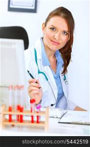 Portrait of attractive medical doctor woman sitting in office&#xA;