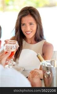 Portrait of attractive woman drinking wine in restaurant