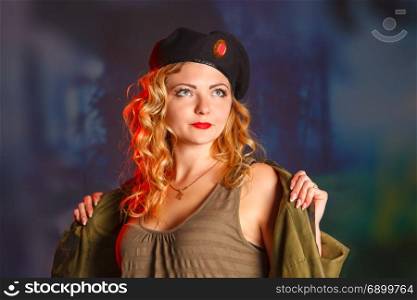 Portrait of attractive woman in military style