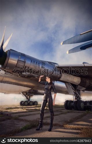 portrait of attractive woman near aircrafts