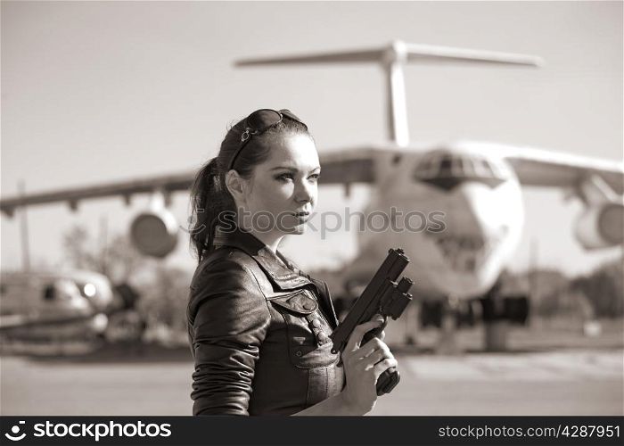 portrait of attractive woman near plane. sepia