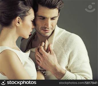 Portrait of attractive young couple in love pose