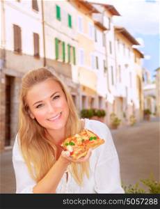 Portrait of attractive young girl eating tasty pizza in the Italy, sitting in the outdoors restaurant, traveling to Europe, happy vacation concept