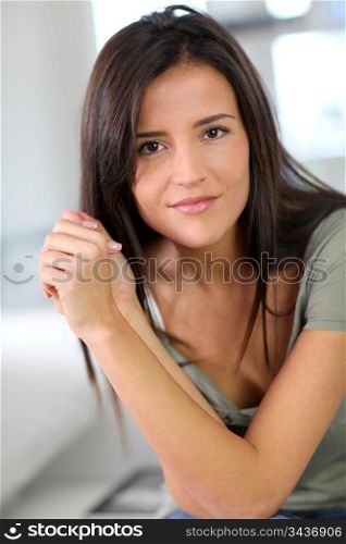 Portrait of attractive young woman relaxing at home