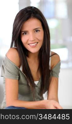 Portrait of attractive young woman relaxing at home