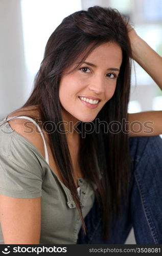 Portrait of attractive young woman relaxing at home