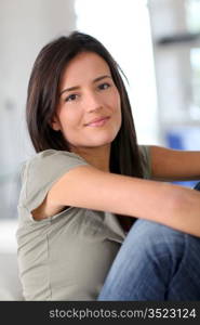 Portrait of attractive young woman relaxing at home