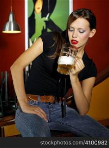 Portrait of attractive young woman with beer