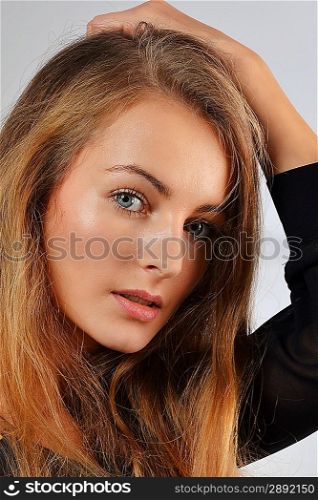 Portrait of attractive young woman with long blond hair
