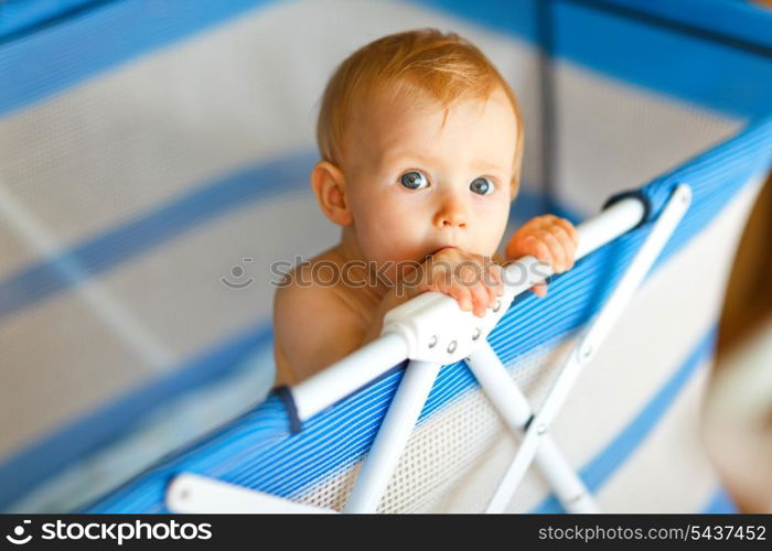 Portrait of baby in playpen&#xA;