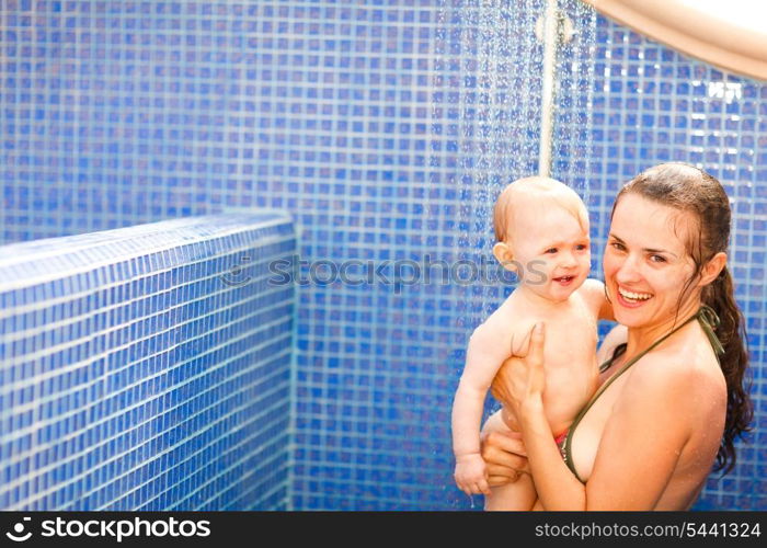 Portrait of baby with mom taking shower&#xA;