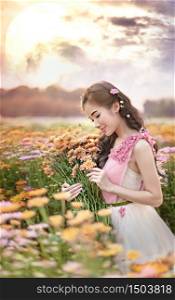 portrait of beautiful asian woman in nature flowers field. portrait of beautiful asian woman