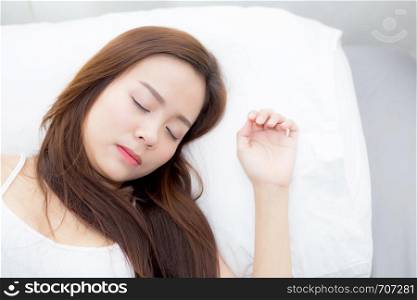 Portrait of beautiful asian young woman sleep lying in bed with head on pillow comfortable and happy with leisure, girl with relax for health and lifestyle concept.