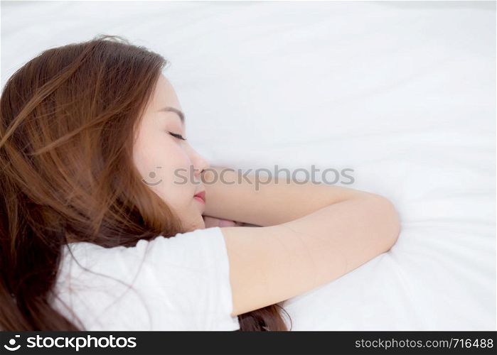 Portrait of beautiful asian young woman sleep lying in bed with head on pillow comfortable and happy with leisure, girl with relax for health and lifestyle concept, top view.