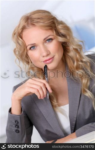 Portrait of beautiful blond businesswoman in office