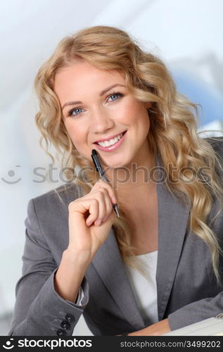 Portrait of beautiful blond businesswoman in office