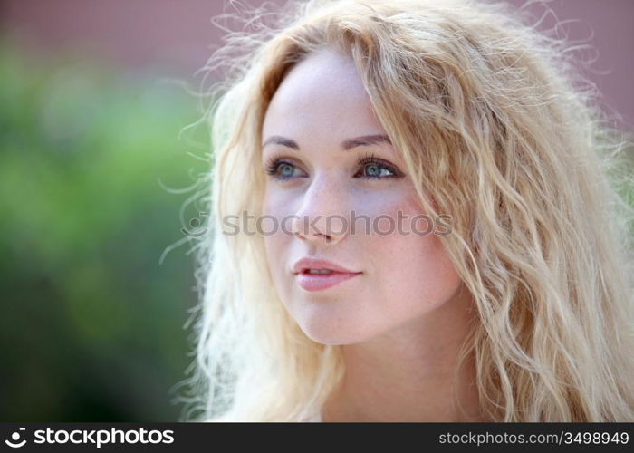 Portrait of beautiful blond smiling woman