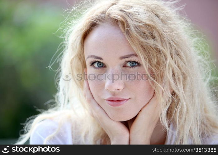 Portrait of beautiful blond smiling woman