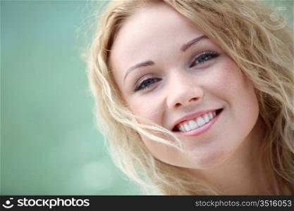 Portrait of beautiful blond smiling woman