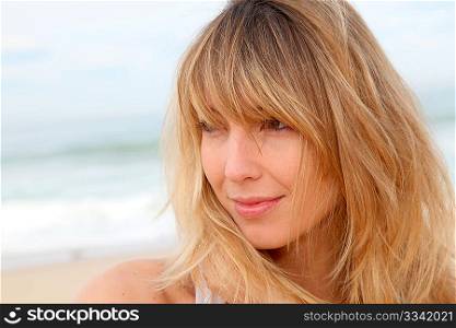 Portrait of beautiful blond woman at the beach