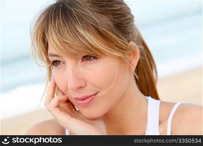 Portrait of beautiful blond woman at the beach