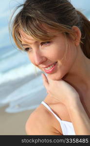 Portrait of beautiful blond woman at the beach