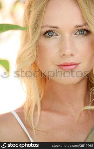 Portrait of beautiful blond woman in nature