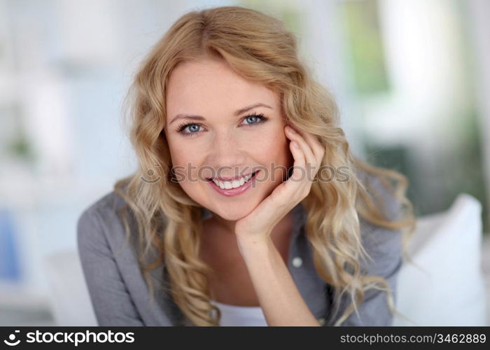 Portrait of beautiful blond woman relaxing at home